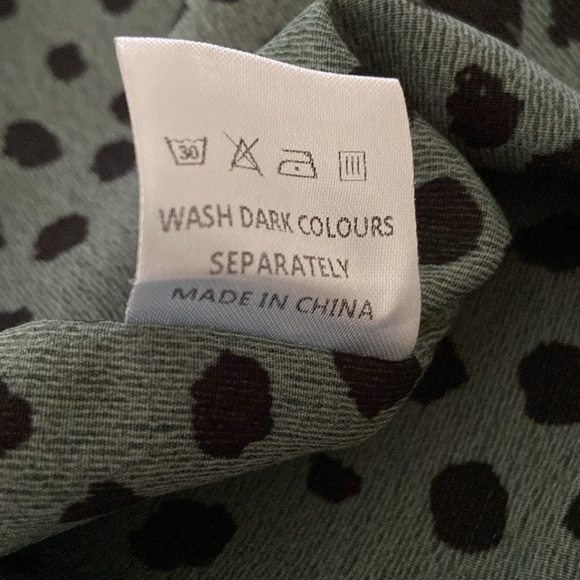 Green and Black Animal Print Blouse with puff sleeves and elastic Ruffle Cuffs. - Picture 4 of 7